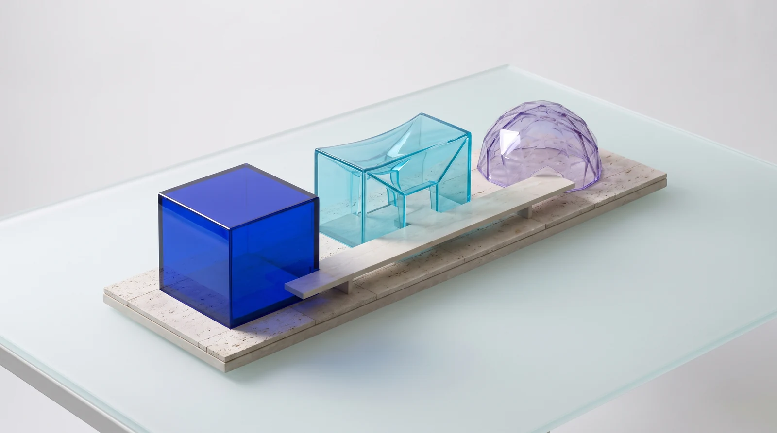 Blue, cyan and violet glass pavilions linked by a narrow passage on a limestone base — an illustration of enterprise deployment choices.