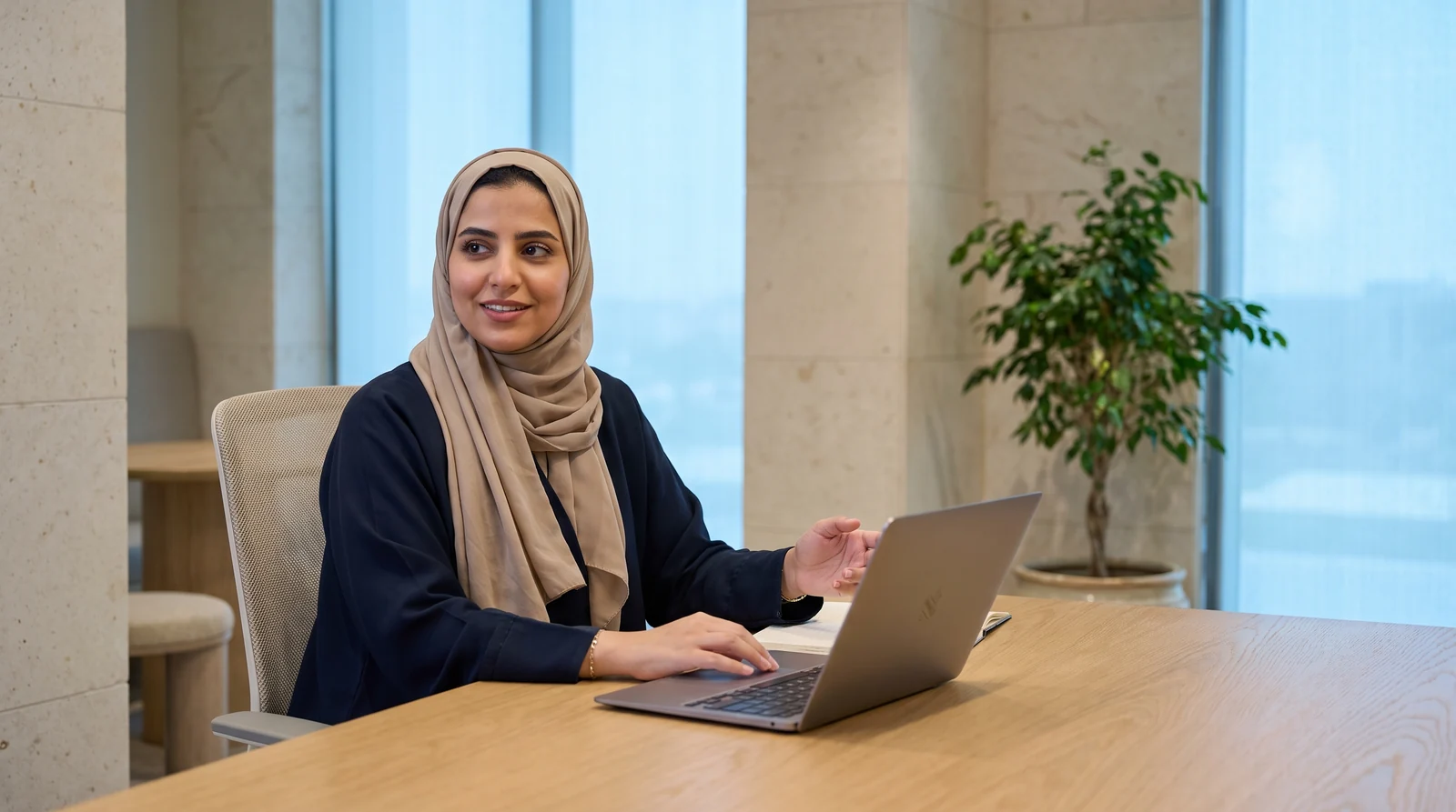 A specialist working at a laptop