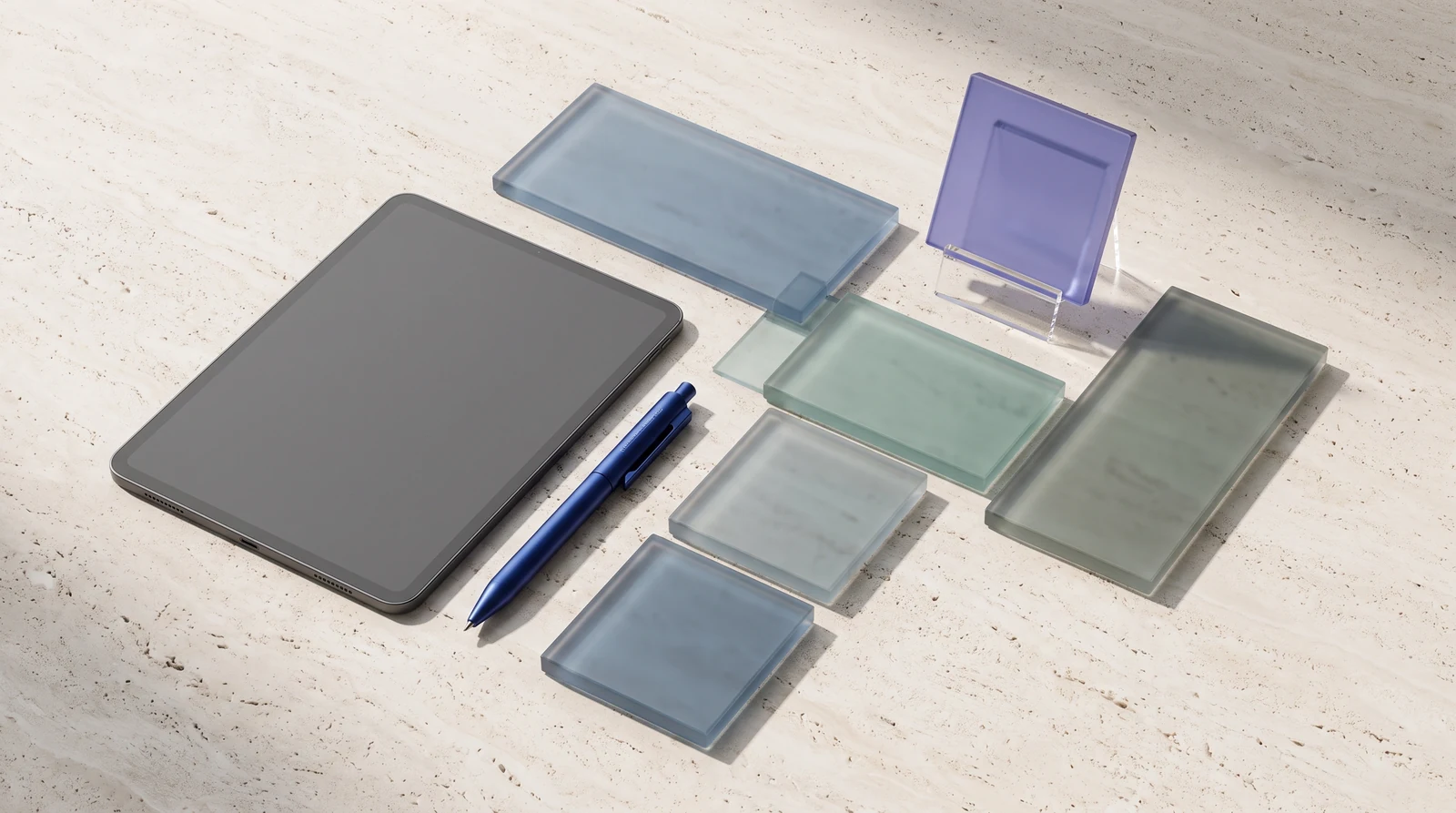 Illustrative overhead arrangement of a tablet and connected glass tiles, with one raised violet tile